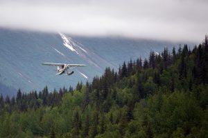 A Super Cub 150 takes off from Upper Trail Lake in Moose Pass, Alaska.