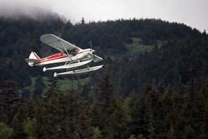 Melissa taking off from Upper Trail Lake in the Super Cub.